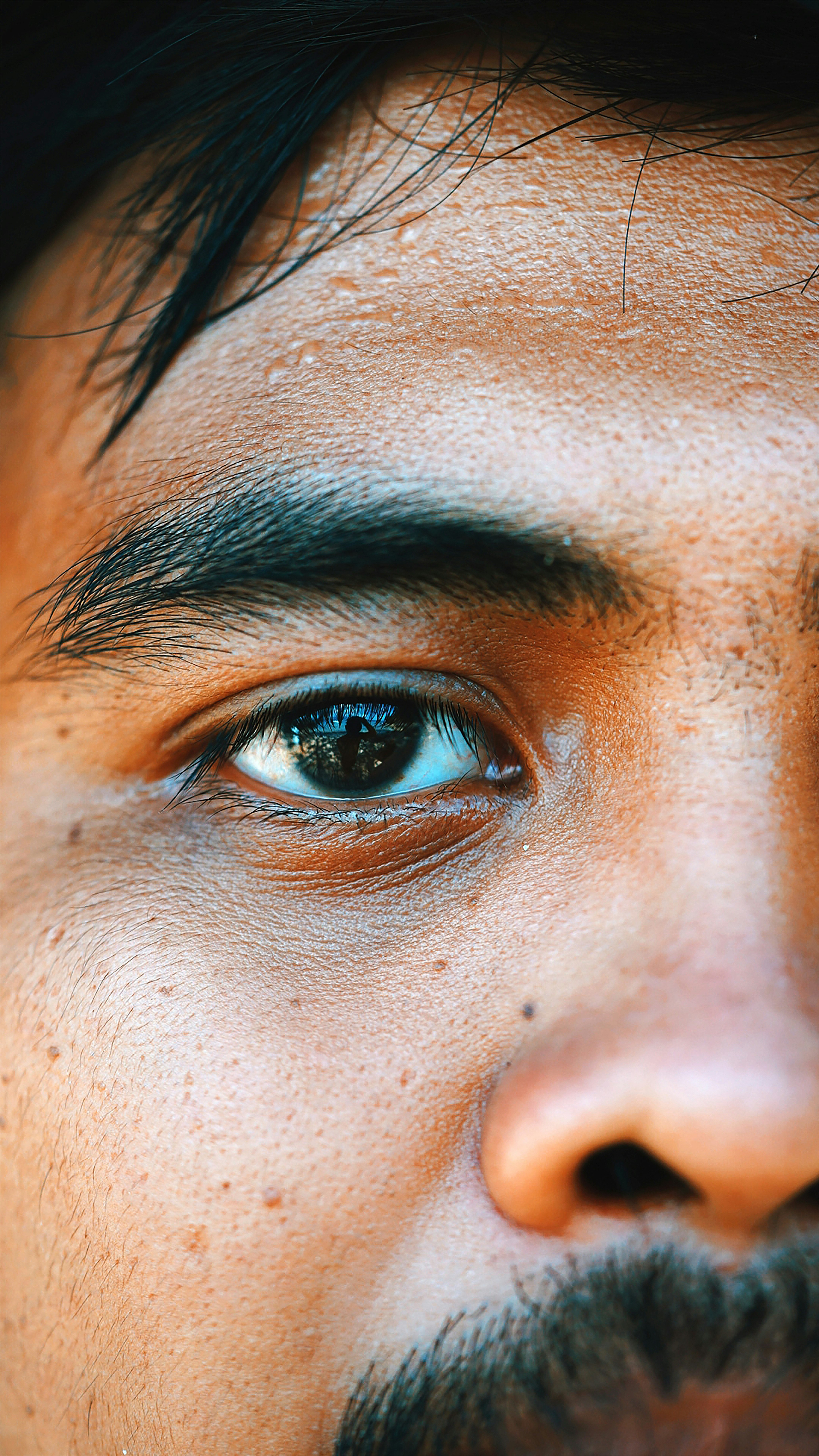 persons eye in close up photography